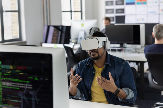 Businessman in an office having a meeting in the metaverse