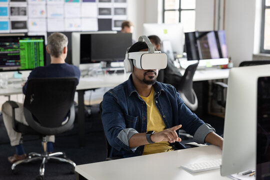 Businessman in an office having a meeting in the metaverse