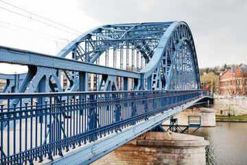 KRAKOW, POLAND - APRIL 11, 2023: Jozef Pilsudski bridge over Wisla river, Krakow, Poland. - obrazy, fototapety, plakaty