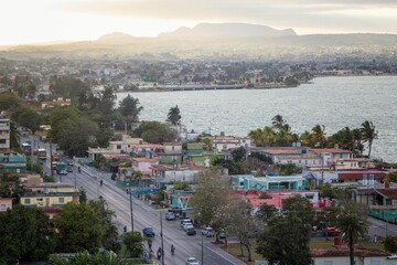Fototapeta na wymiar Aerial shot of the India Dormida mountains and Matanzas city in Cuba under the sunset sky