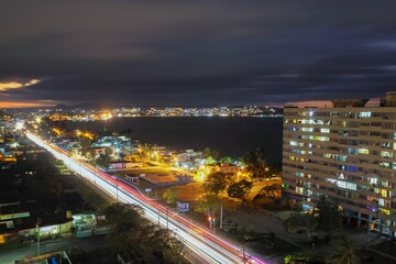 Fototapeta na wymiar Long exposure shot of the traffic light of the illuminated Matanzas in Cuba at night