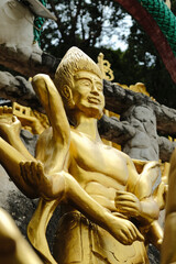 Fototapeta na wymiar Buddhism Religion Golden Temple Image Sough-East Asian Praying Statue