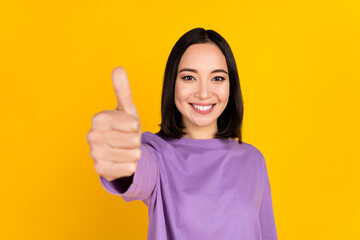 Photo of positive korean young girl thumb up rate nice feedback give compliment excellent product...