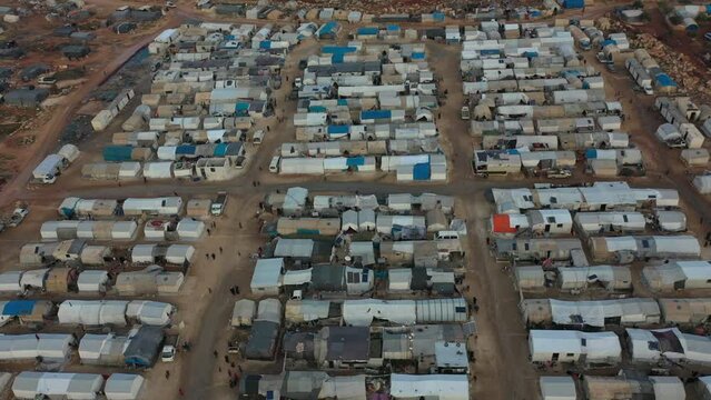Drone shot of hundreds of tents inhabited by Syrian refugees for years due to the war that destroyed their homes.