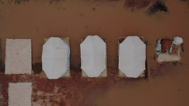 Top view of a Syrian refugee camp. Syrian refugee tents flooded due to heavy rains.
