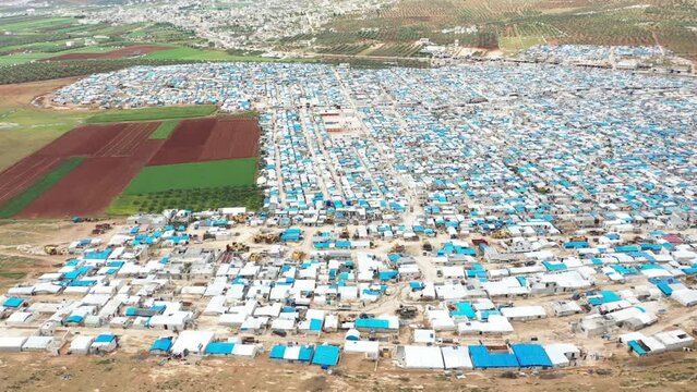 Drone shot of hundreds of tents inhabited by Syrian refugees for years due to the war that destroyed their homes.