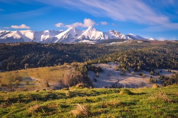 Naklejka premium Beautiful morning spring landscape in the countryside. View of the Belianske Tatras from the village of Osturna in Slovakia.