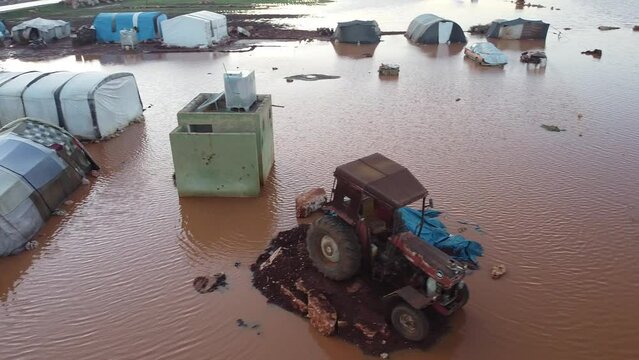 Top view of a Syrian refugee camp. Syrian refugee tents flooded due to heavy rains.