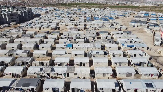 Drone shot of hundreds of tents inhabited by Syrian refugees for years due to the war that destroyed their homes.