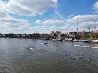 Three rowing boats  on River Thames at Puntney London UK drone aerial view © Air Video UK 
