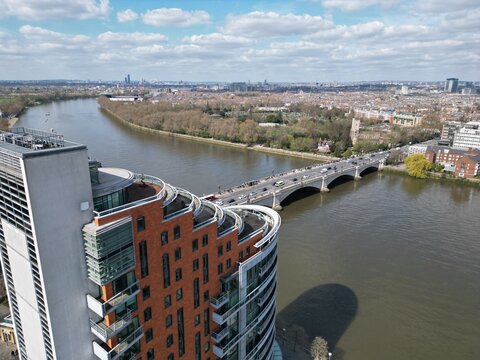 Putney Bridge London UK drone aerial view over luxury riverside apartment with penhouse