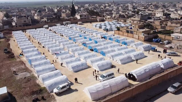 Drone shot of hundreds of tents inhabited by Syrian refugees for years due to the war that destroyed their homes.