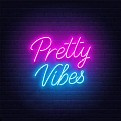 Fototapeta na wymiar Pretty Vibes neon lettering on brick wall background.
