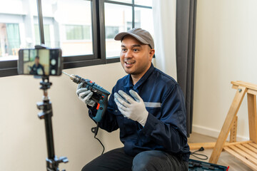 Technician is record video broadcasting live teaching how to use construction tools.