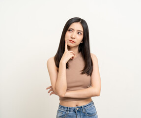 Beautiful young asian woman in brown shirt. Charming female lady standing pose thinking on isolated white blank background. Asian cute people looking copy space for text advertise