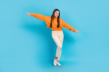 Full body portrait of lovely satisfied person arms wings have good mood isolated on blue color...