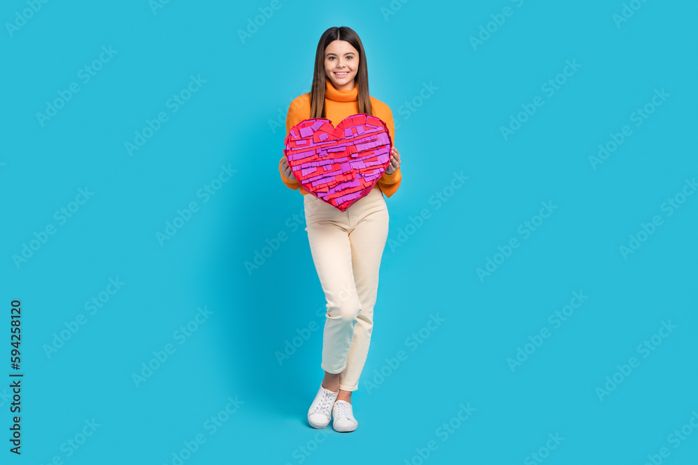 Poster full body photo of cheerful sweet person hands hold large heart symbol collage isolated on blue colo