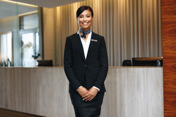 Welcoming with a smile: Portrait of a young Asian woman working as a hotel receptionist