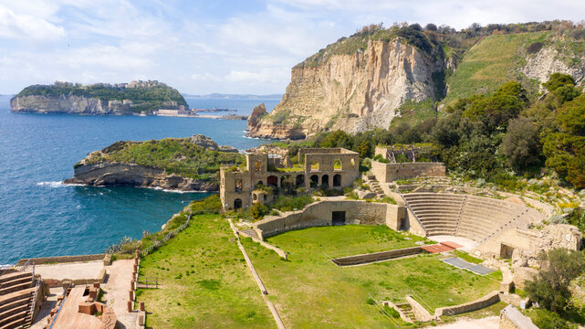 Aerial view of the Roman theater in the Pausilypon archaeological park. These ancient Roman ruins are located in Posillipo district in Naples, Campania, Italy. In the background the island of Nisida.