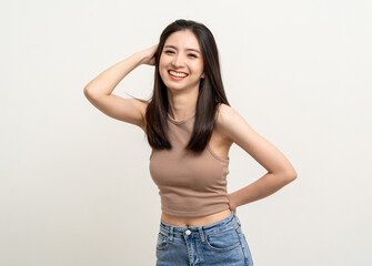 Beautiful smiling happy young asian woman age around 25 in brown shirt. Charming female lady standing pose on isolated white background. Asian cute people looking camera confident with white backdrop.