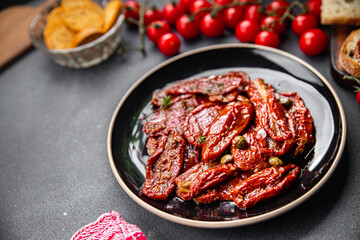 sun dried tomato vegetable appetizer healthy meal food snack on the table copy space food background rustic top view keto or paleo diet veggie vegan or vegetarian food