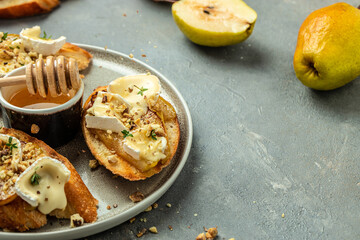 Sweet toast with pear, cheese and honey. party appetizer. banner, menu, recipe place for text, top view
