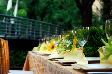 Cheerful yellow flowers set the scene for a magical summer outdoor banquet.