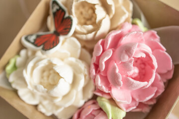 sweet dessert, marshmallow in the shape of a pink peony flower on a light background. Sugar addiction, consumption, handmade dessert. Low calorie marshmallows, carbs