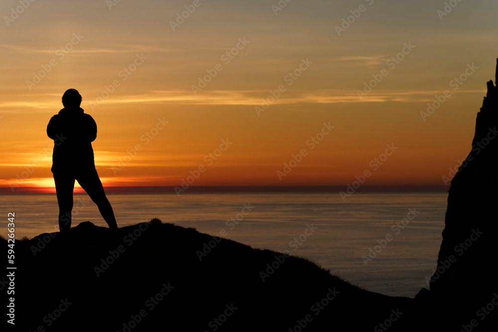 Sticker silhouette of a person at the sea at sunset