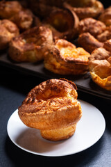 Food Concept Homemade spot focus Yorkshire pudding on black background with copy space