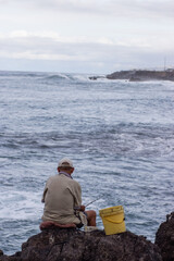 man fishing in the sea, canarian coastline
