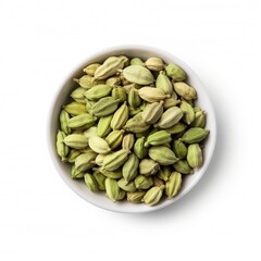 green cardamomo in white bowl, isolated on white background. seasoning, indian, recipe. ingredient.
