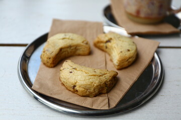 Crescent shape, Tahini and cinnamon cookie made by butter and sesame butter, very tasty,yummy with chocolate drops.
