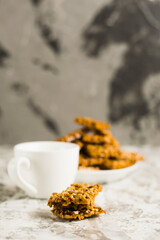 Gozinaks, Georgian sweets and espresso coffee in a white cup on a light gray table