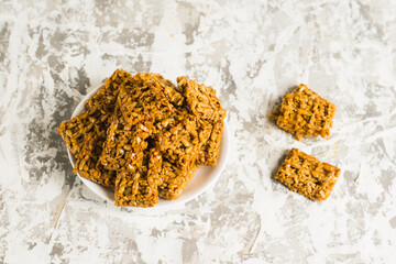 Gozinaks, delicious Georgian sweets on a light gray concrete background