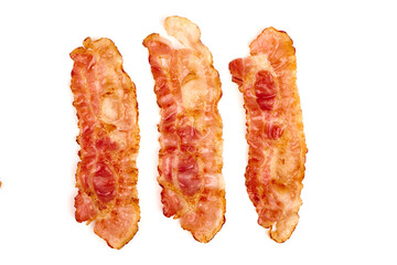 Cooked bacon rashers close-up isolated on a white background.