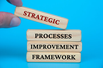 Strategic process improvement framework text on wooden blocks. Business culture and Operational excellence concept