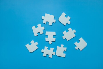 Top view Puzzle pieces on blue background, Jigsaw puzzle with missing piece, Missing jigsaw puzzle pieces and business concept.