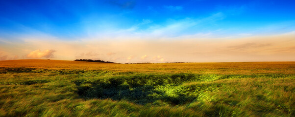 A photo of sunset in the countryside at summertime. A photo of sunset in the countryside at summertime.