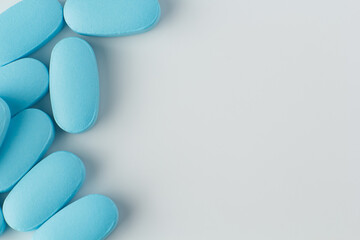 blue tablets on a light background, vitamins and medicines