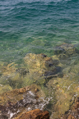 beautiful view on the sea with wild stone coast and waves