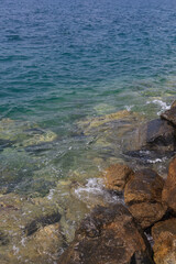 beautiful view on the sea with wild stone coast and waves