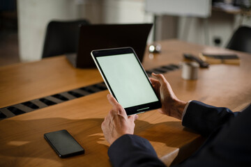 Close up of man using digital tablet
