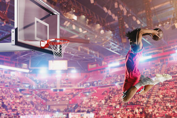 Basketball player jumping to make a basket during a match