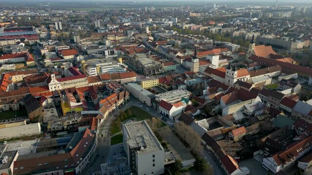 Old town district of Trnava, drone is flying over the streets, bell towers, 4k