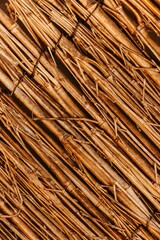 Rustic wooden background featuring a textured surface with straws, perfect for wallpapers