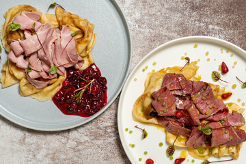 Homemade pancakes with pastrami and ham