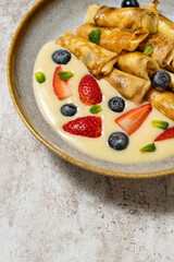 Pancakes with berries and condensed milk