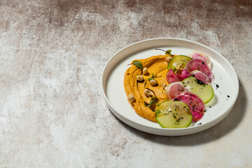 Hummus with pumpkin and radish