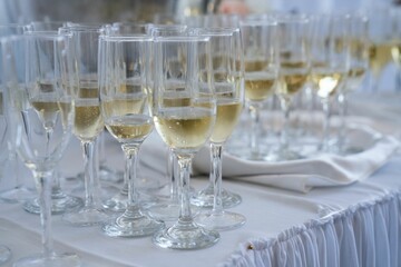 Closeup of glasses of champagne on the wedding table.
